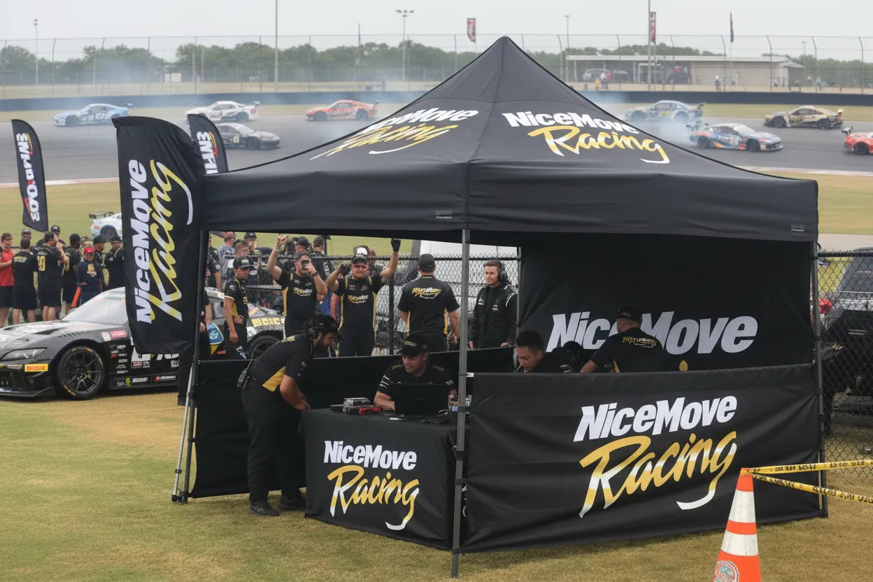 Custom black and gold pop-up canopy tent at a car racing event