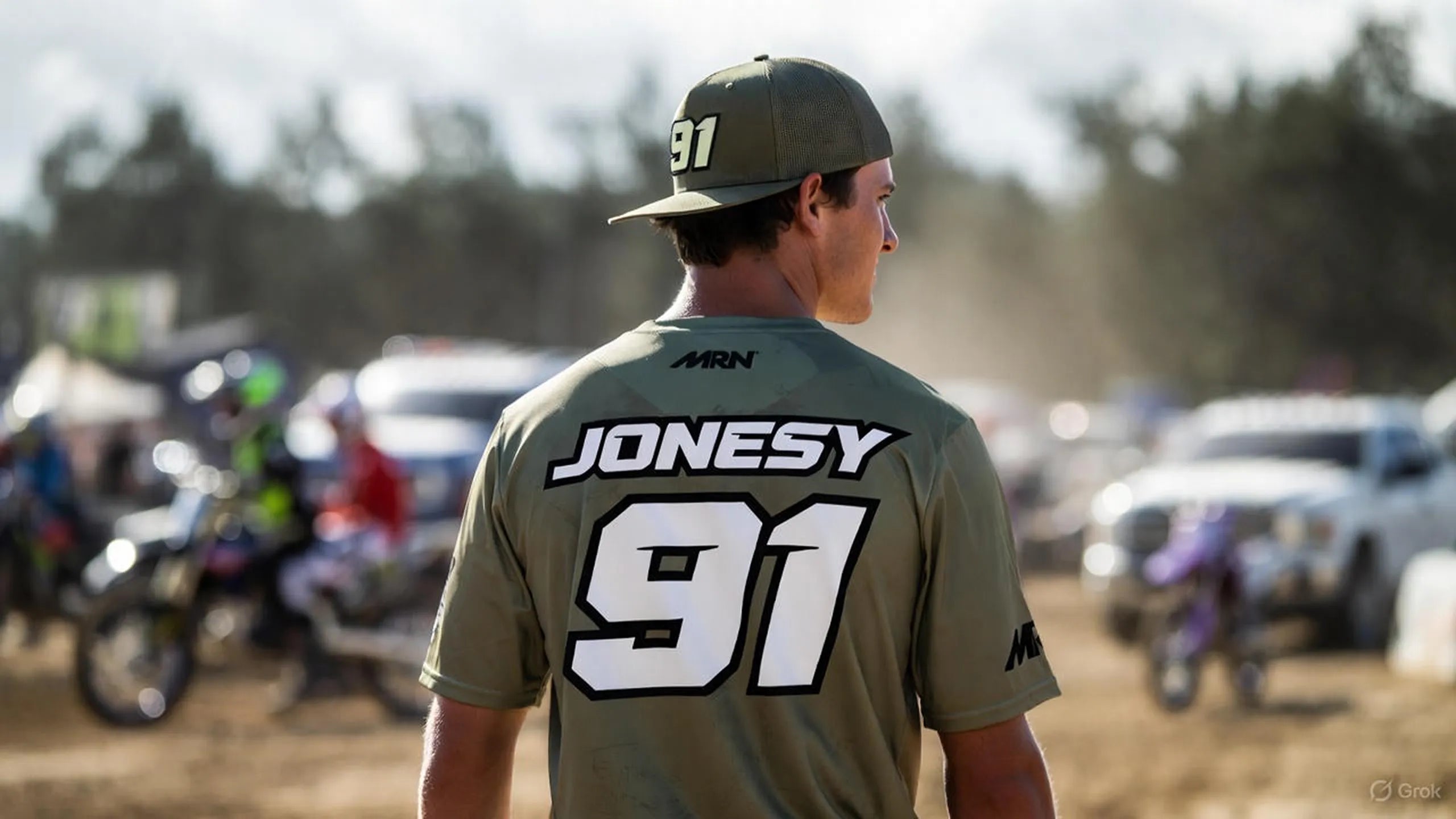Motocross rider wearing a custom MRN T-shirt with race name and number in the pit area