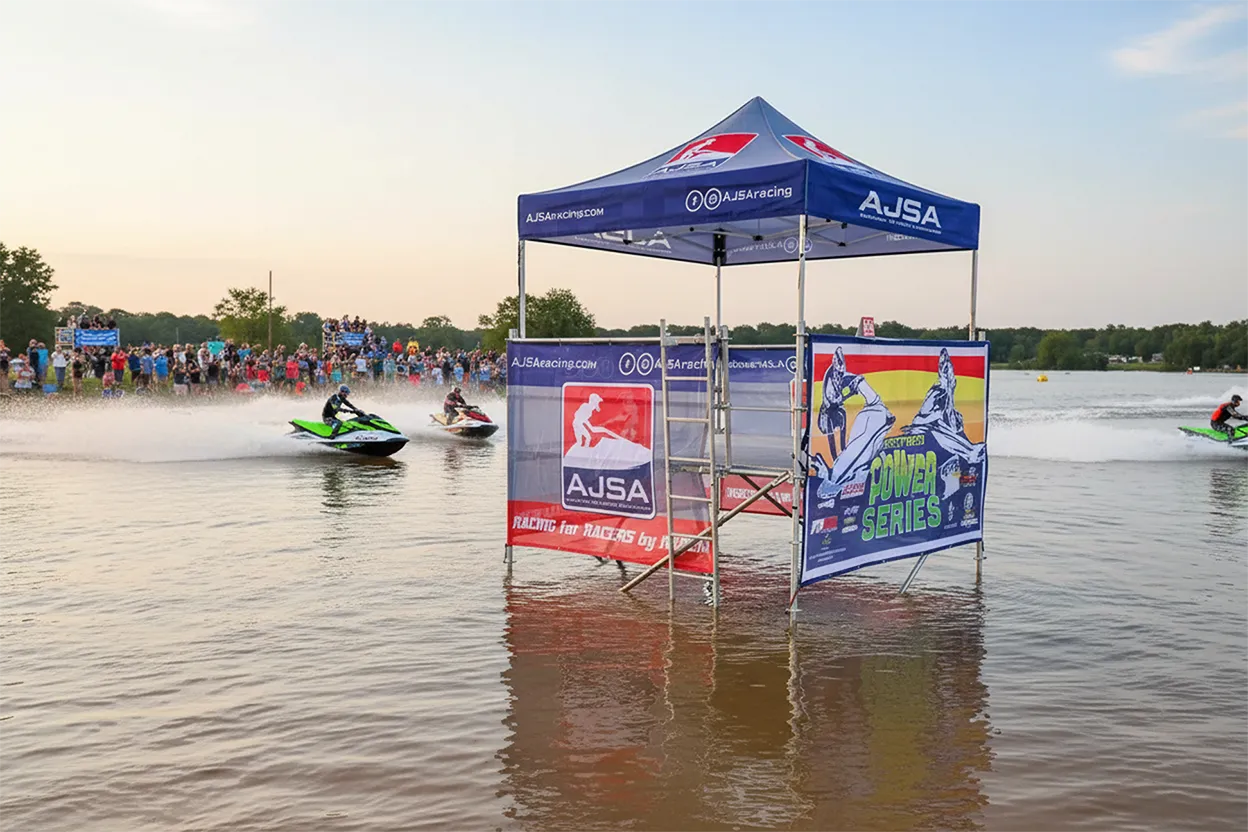 Custom branded pop-up canopy tent at a jet ski racing event near the waterfront