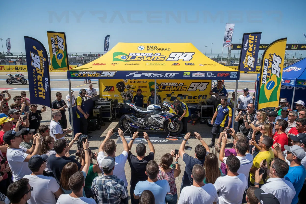 Custom pop-up canopy tent at a superbike racing event with team and fans