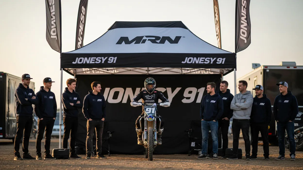 Custom MRN motocross pop-up canopy tent used as a race team pit setup at the track