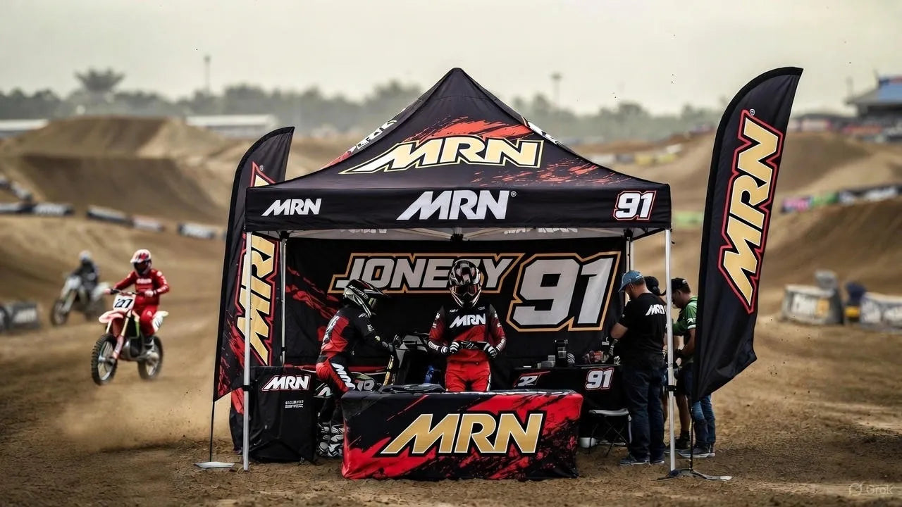 Custom MRN racing canopy pop-up tent at a motocross track, designed for race teams, fans, and event branding.