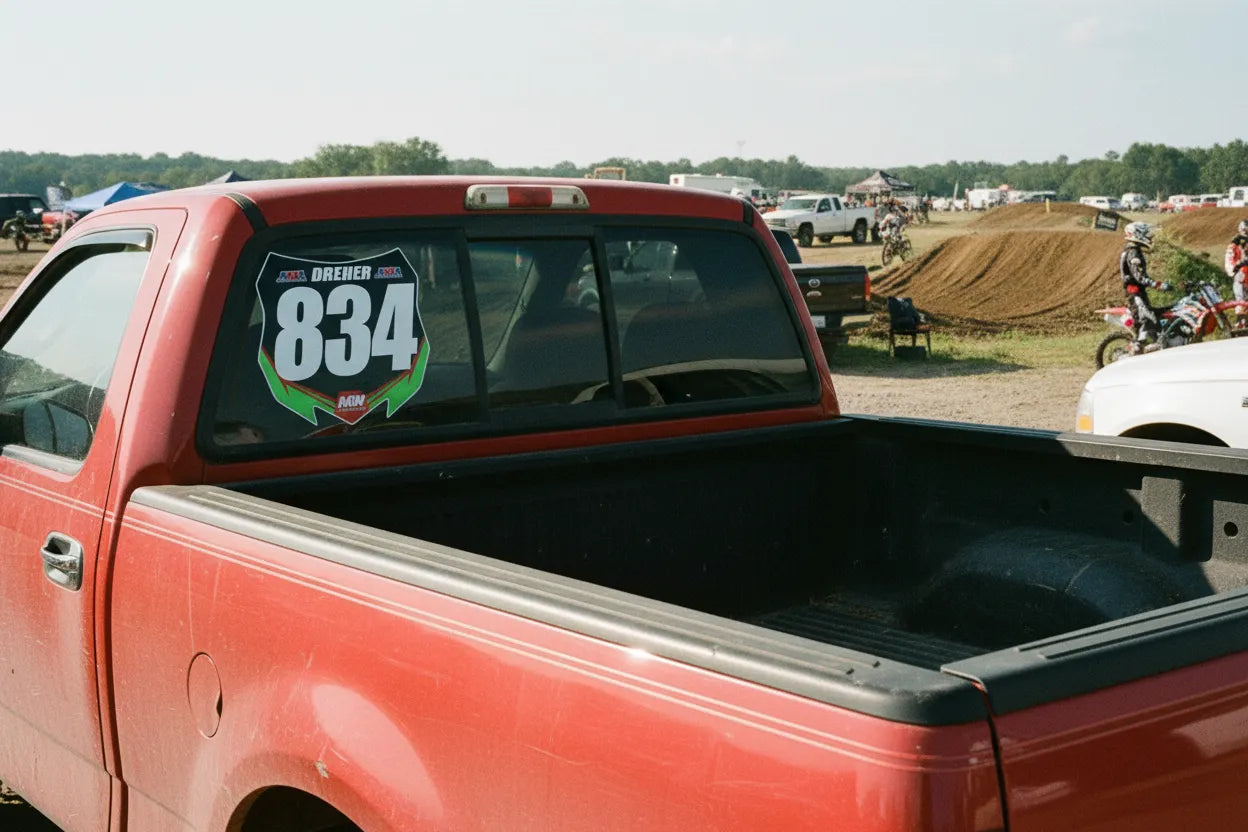 Red pickup truck with a motocross race number on the rear window that inspired the original MyRaceNumber idea
